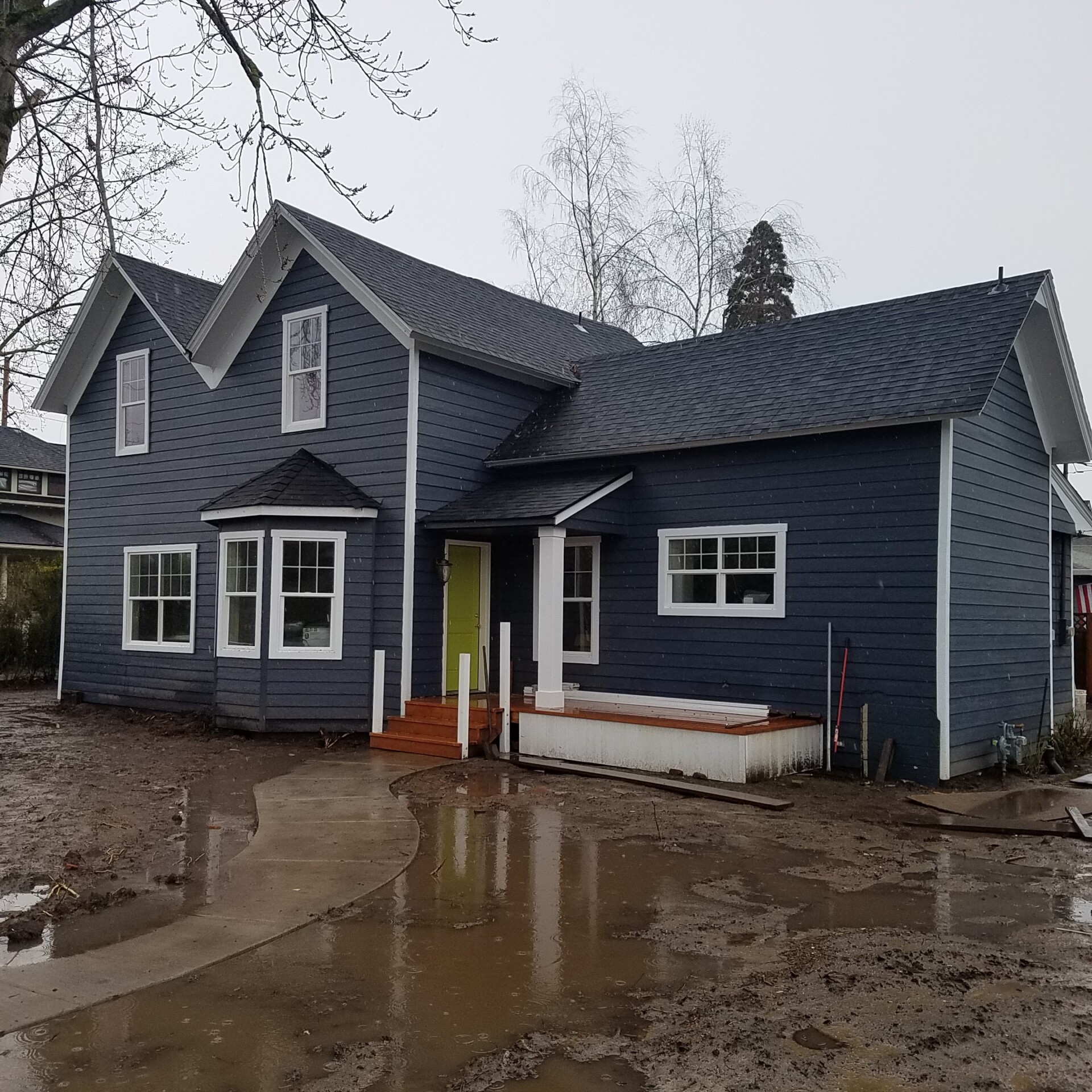 Windows and Siding redone, rainy muddy yard
